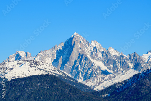 The Aiguille Verte in the Mont Blanc massif in Europe  France  Rhone Alpes  Savoie  Alps  in winter on a sunny day.
