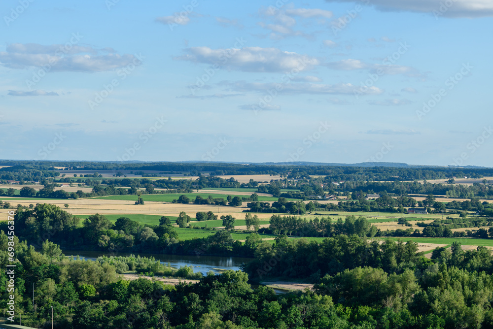 Loire river in the middle of green countryside in Europe, France, Burgundy, Nievre, Pouilly sur Loire, towards Nevers, in summer, on a sunny day.