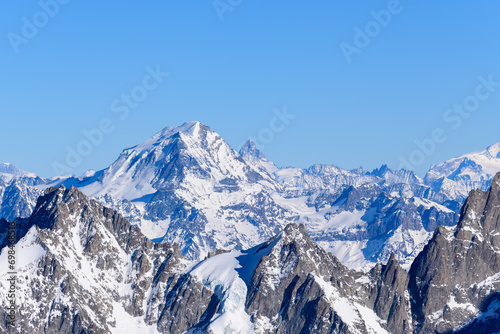 Le Grand Combin and Mont Cervin in Europe  France  Rhone Alpes  Savoie  Alps  in winter on a sunny day.