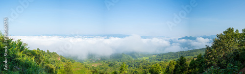 The clouds above the city seen from the green mountains , in Asia, Vietnam, Tonkin, Dien Bien Phu, in summer, on a sunny day.