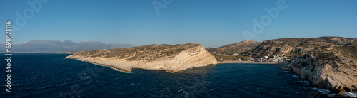 The panoramic view of the city center and its beach and cliffs, in Europe, Greece, Crete, Matala, By the Mediterranean Sea, in summer, on a sunny day.