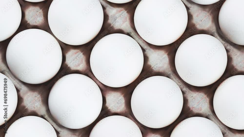 Rotating a tray of chicken eggs in a factory. View from above. Rotating a tray of chicken eggs in a factory. View from above.