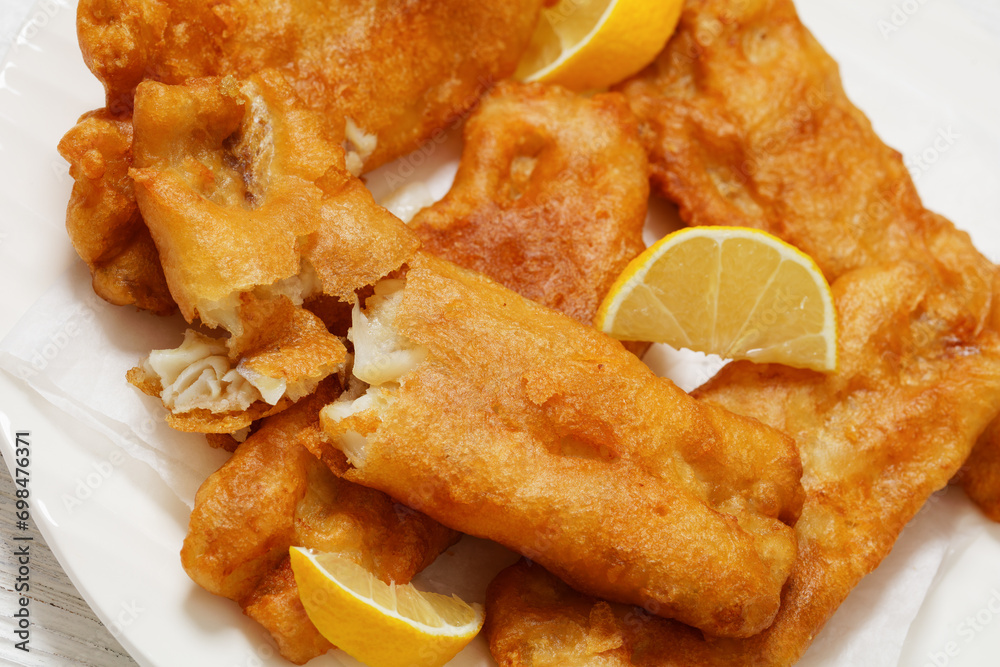 deep fried crispy beer batter fish fillet on plate deep fried crispy beer batter fish fillet on plate