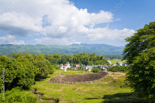 The crater of the fortified position of Elianne 2, in Asia, Vietnam, Tonkin, Dien Bien Phu, in summer, on a sunny day. photo