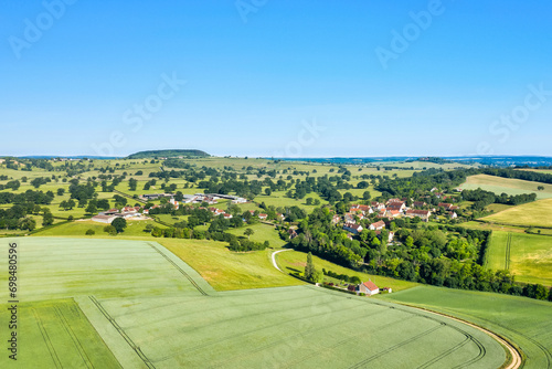 A French village in the green countryside in Europe, France, Burgundy, Nievre, Cuncy les Varzy, towards Clamecy, in summer on a sunny day. photo