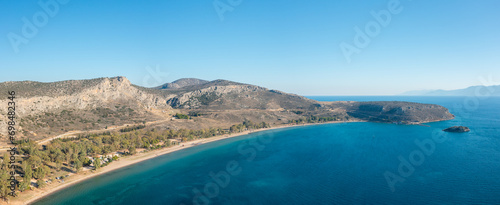 Paralia karathona Beach on arid rocky coast and countryside, Europe, Greece, Peloponnese, Argolis, Nafplion, Myrto seashore, in summer on a sunny day. © Florent