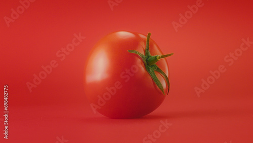 Tomato on Red Background © Clynshot