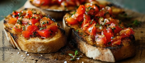 Delicious Pan con tomate - grilled bread topped with tomato, salt, and olive oil. Traditional Catalan wine tapas. photo