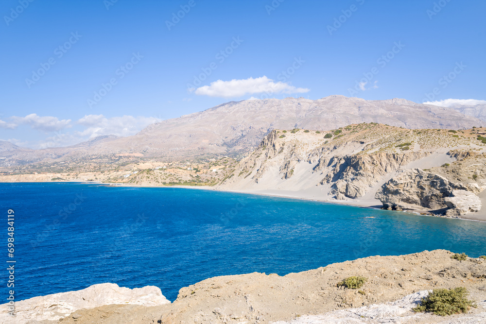 The rocky coast and its arid cliffs , in Europe, Greece, Crete, Agios Pavlos, By the Mediterranean Sea, in summer, on a sunny day.