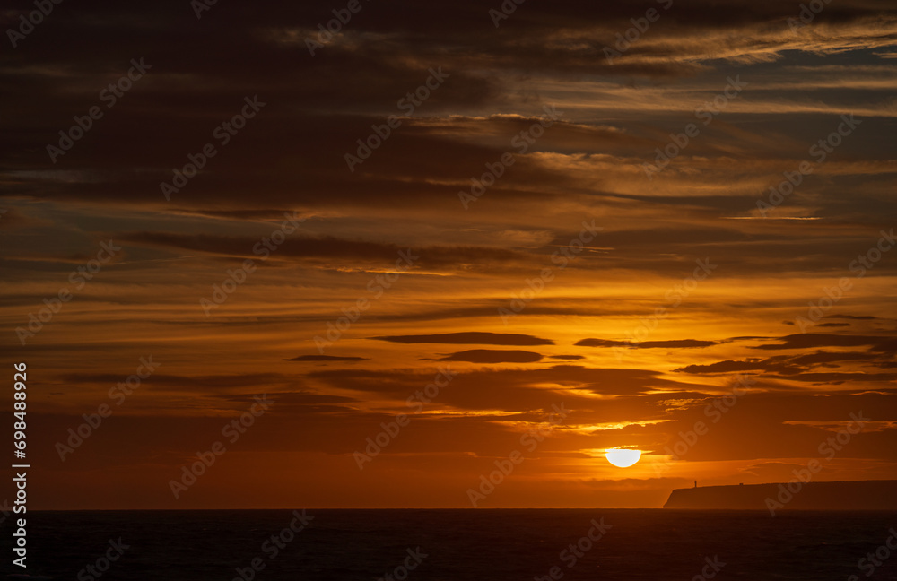 Majestic Lighthouse Overlooking Sunset and Infinite Sea Majestic Lighthouse Overlooking Sunset and Infinite Sea