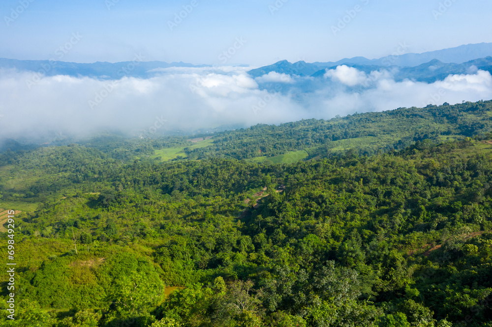 The clouds above the city seen from the green mountains , in Asia, Vietnam, Tonkin, Dien Bien Phu, in summer, on a sunny day. The clouds above the city seen from the green mountains , in Asia, Vietnam, Tonkin, Dien Bien Phu, in summer, on a sunny day.