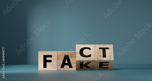 Flipping Wooden cube block for change fake to fact , news and social media concept. photo