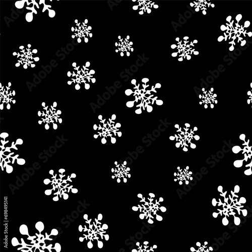 Monochrome winter seamless pattern with white silhouettes of snowflakes on black. Greeting card, gift packaging., wrapping paper. Funny scrabble style collection for happy new year. 