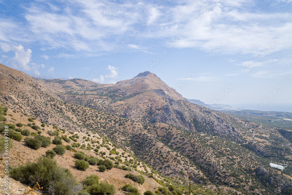 The rocky and arid mountains in the countryside , Europe, Greece, Crete, towards Myrtos, By the Mediterranean sea, in summer, on a sunny day.
