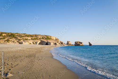 The rocks by Triopetra Beach , in Europe, Greece, Crete, towards Rethymno, By the Mediterranean Sea, in summer, on a sunny day.
