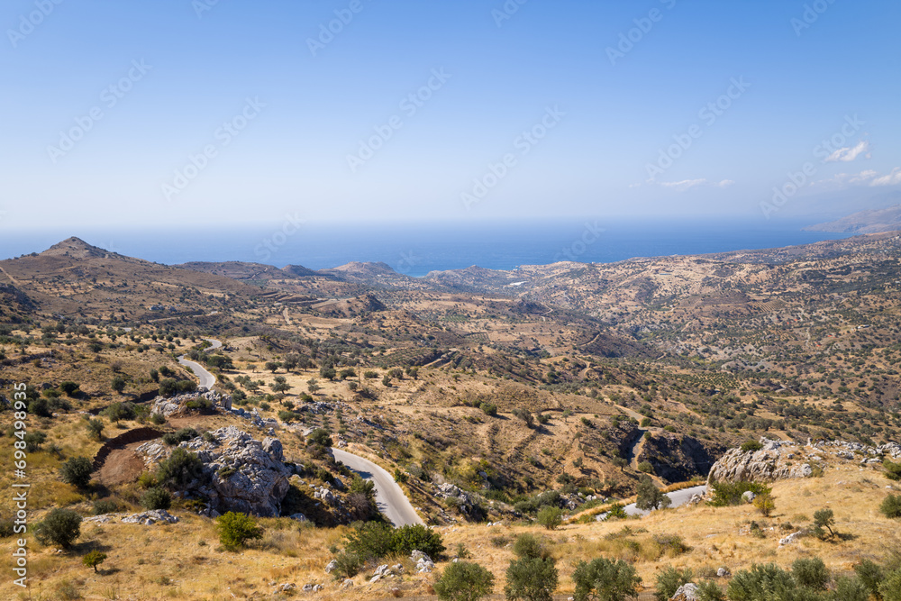 The arid countryside in the south of the island , in Europe, Greece, Crete, towards Preveli, By the Mediterranean sea, in summer, on a sunny day.
