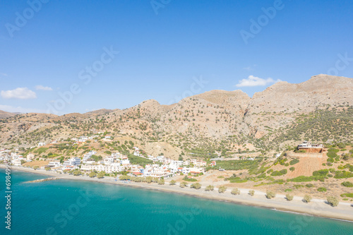 Fototapeta Naklejka Na Ścianę i Meble -  The city center at the foot of the arid mountains , in Europe, Greece, Crete, Tsoutsouros, By the Mediterranean Sea, in summer, on a sunny day.