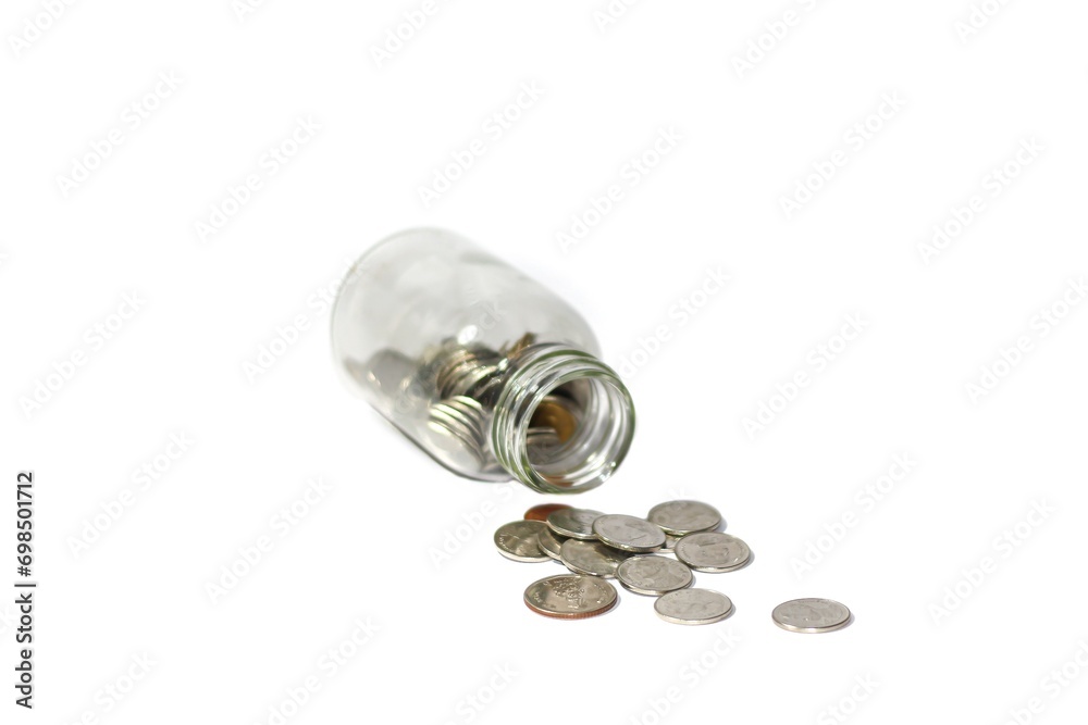 Coins in the bottle and calculator put on white background. Concept isolated picture.