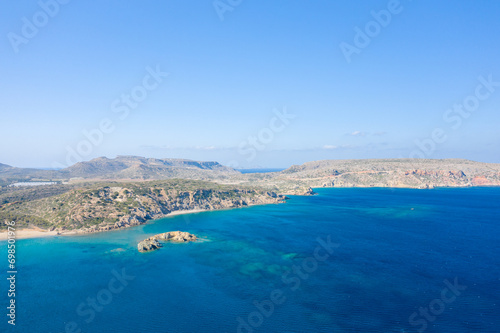 The barren rocky coast and sandy beach of Vai   Europe  Greece  Crete  towards Sitia  By the Mediterranean Sea  in summer  on a sunny day.
