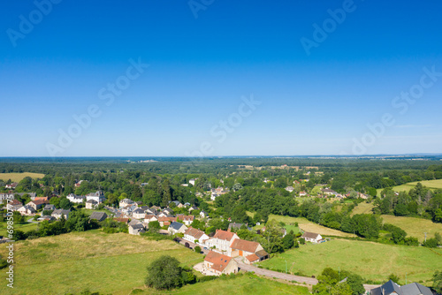 A traditional village old seaside resort in the middle of the countryside in Europe, France, Burgundy, Nievre, Saint-Honoré-les-Bains, towards Chateau Chinon, in summer on a sunny day. © Florent