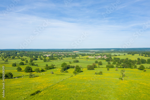 A French village in the green countryside in Europe, France, Burgundy, Nievre, Cuncy les Varzy, towards Clamecy, in Spring, on a sunny day. photo