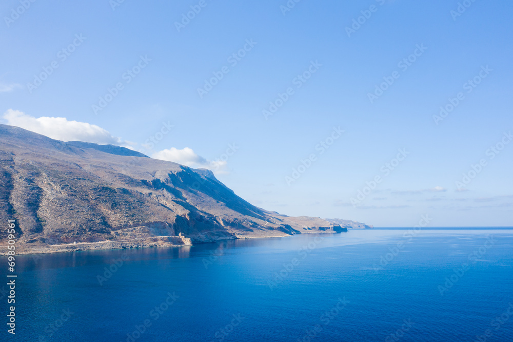 The tip of Balos and its arid mountains , in Europe, in Greece, in Crete, towards Kissamos, towards Chania, By the Mediterranean Sea, in summer, on a sunny day.