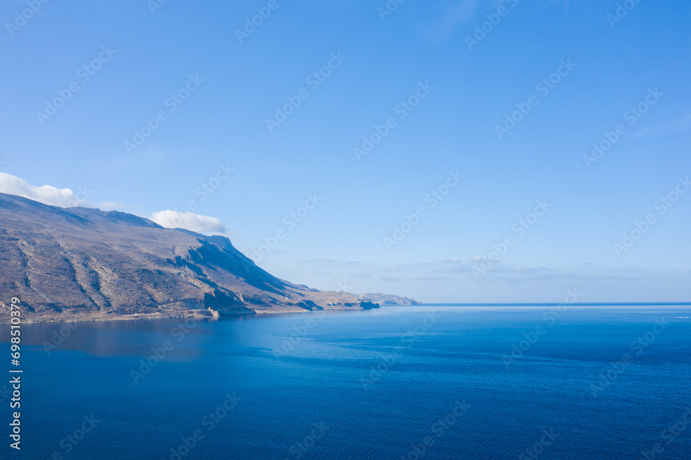 The tip of Balos and its arid mountains , in Europe, in Greece, in Crete, towards Kissamos, towards Chania, By the Mediterranean Sea, in summer, on a sunny day.