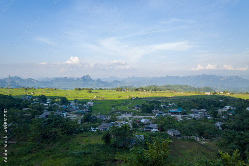 A traditional village in the middle of countryside and mountains, in Asia, Vietnam, Tonkin, towards Hanoi, Mai Chau, in summer, on a sunny day.