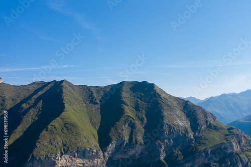 The Mountains around Gavarnie Gedre in the arid green countryside , Europe, France, Occitanie, Hautes-Pyrenees, in summer on a sunny day. © Florent