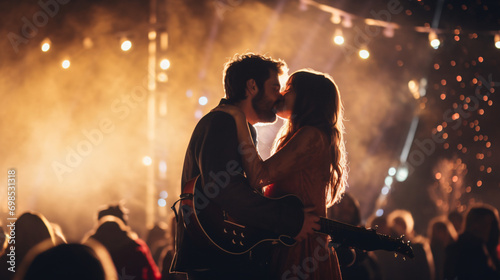 A Valentines Day concert under the stars with a couple dancing to live music and sharing a passionate kiss.