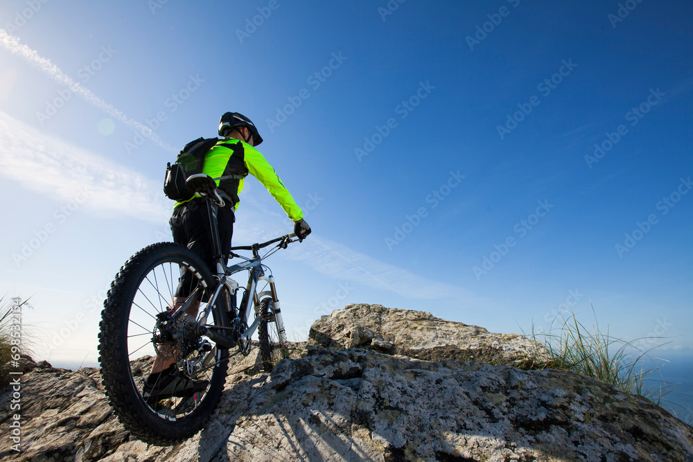 Mountain biker riding on his btt bike Mountain biker riding on his btt bike