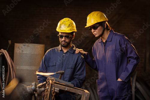 Photography Two welder workers working at factory