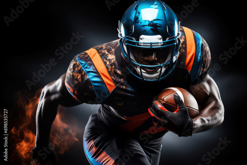 Portrait of American football player running with the ball. Muscular athlete in a blue and orange uniform with an ovoid ball in a dynamic pose. Isolated on black background.