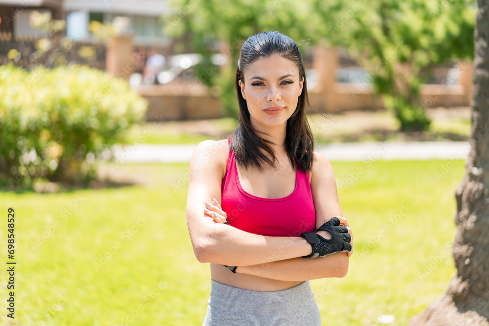 Young pretty sport woman at outdoors with confuse face expression Young pretty sport woman at outdoors with confuse face expression