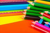 Close-up of a variety of vibrant colored pencils for drawing on a vibrant and bright background