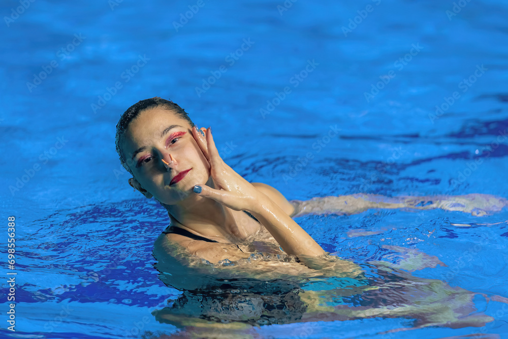 Serene beauty of solo synchronized swimming, a captivating display of aquatic grace and precision.