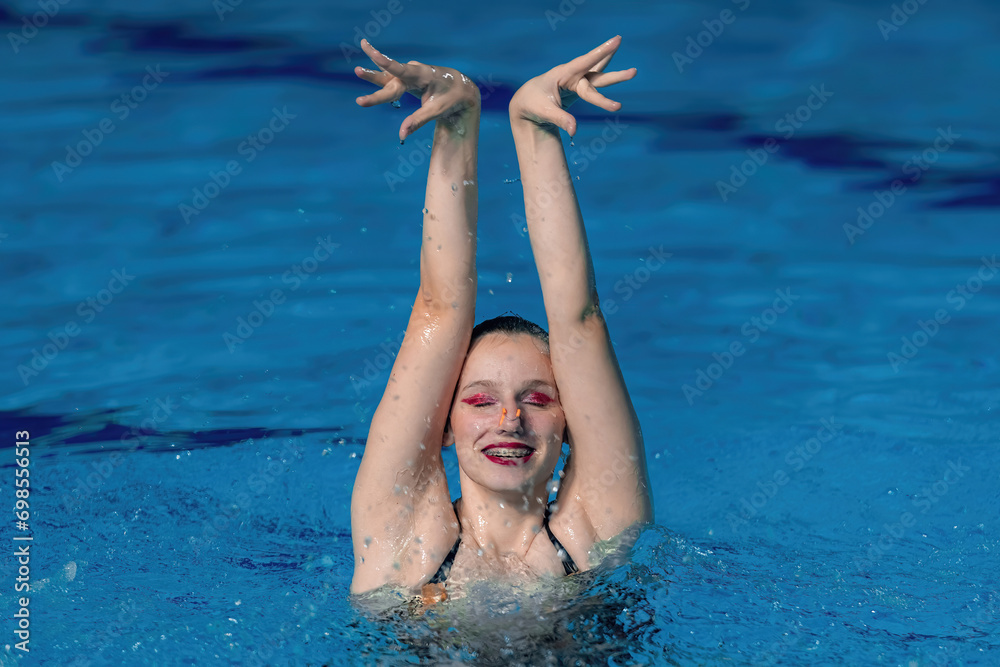 Art of solo synchronized swimming with a mesmerizing training session, blending precision and aquatic grace