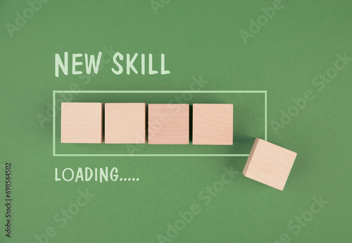 Progress bar with the words new skill loading, education concept, having a goal, online learning, knowledge is power strategy
