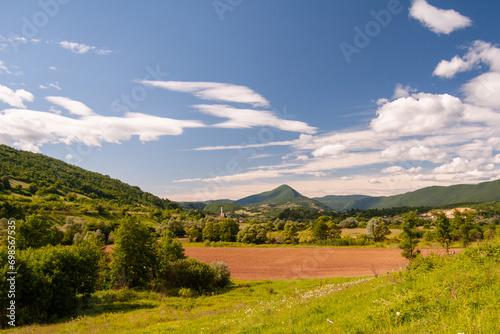 Dramatic Mountainous Horizon - A picturesque scene of towering peaks and valleys, creating a dramatic and awe-inspiring landscape