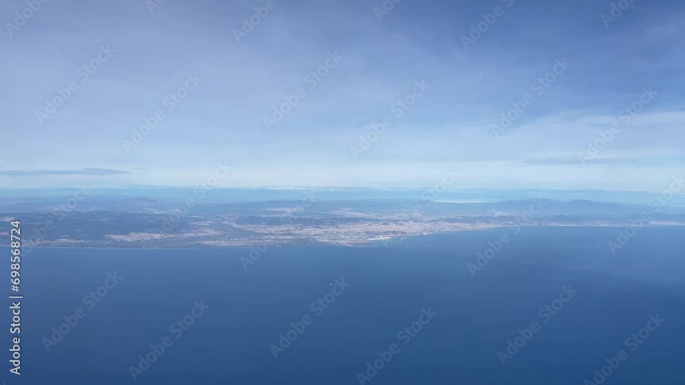 Aerial view on the city of Barcelona in the distance against the blue sky Aerial view on the city of Barcelona in the distance against the blue sky