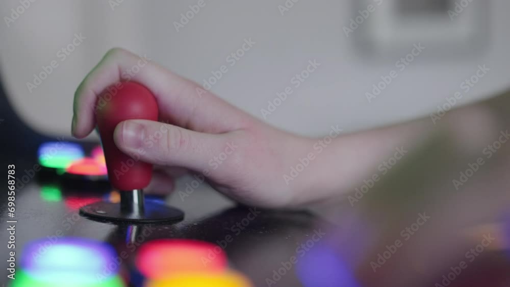 Teenage girl using arcade machine close up Teenage girl using arcade machine close up