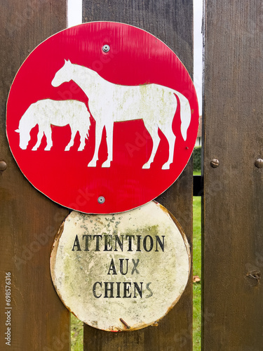 Road sign with the text beware of the horses
