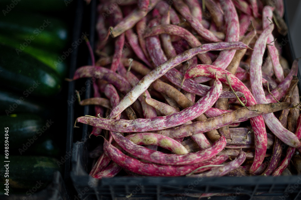 Bean pods for sale in market. Dragon tongue bean. Bean pods for sale in market. Dragon tongue bean.