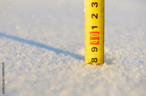 snow level measured with a tape measure photo