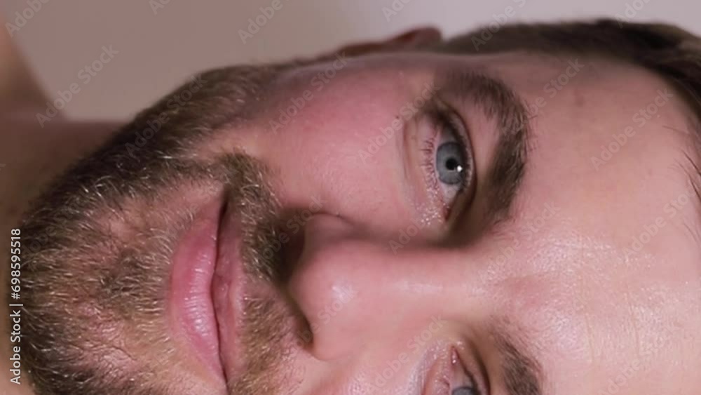 Portrait of a smiling Caucasian man. Close up. Vertical video Portrait of a smiling Caucasian man. Close up. Vertical video