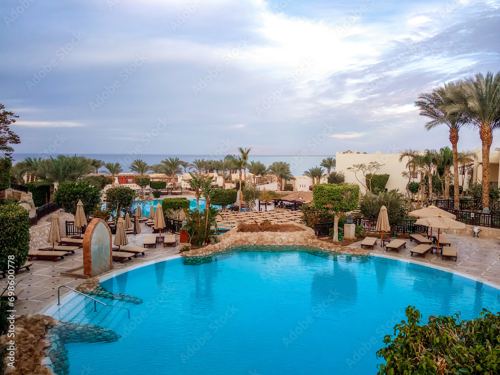 empty lawn with folded umbrellas on the coast of southern Sinai Egypt Sharm El Sheikh