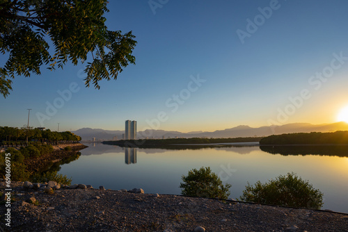 Ras al Khaimah emirate  viewin the northern United Arab Emirates  cityscape landmark and skyline view above the mangrove and corniche downtown area at dawn photo