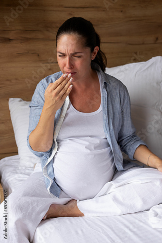 Pregnant woman is sick at home