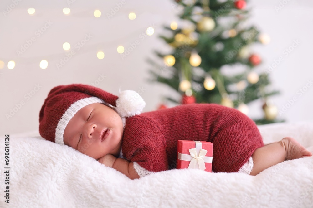 Cute New born baby sleeping in santa claus hat and gift box. Cute New born baby sleeping in santa claus hat and gift box.