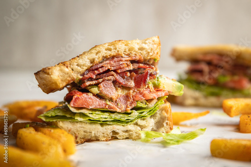 BLTA sandwich on toasted white bread, healthy food.